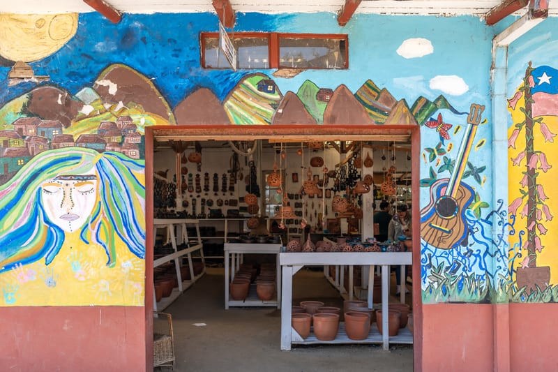 Clay pieces for sale at a craft stall in Pomaire.