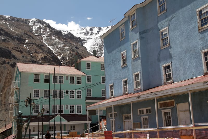 Stacked, brightly painted timber buildings on the hillside in central Sewell.